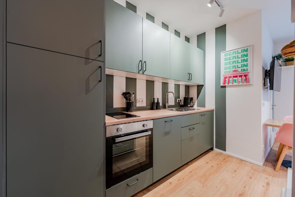 Kitchen or kitchenette, dishwasher, oven, stove