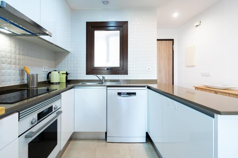 Kitchen or kitchenette, dishwasher, oven, stove, toaster