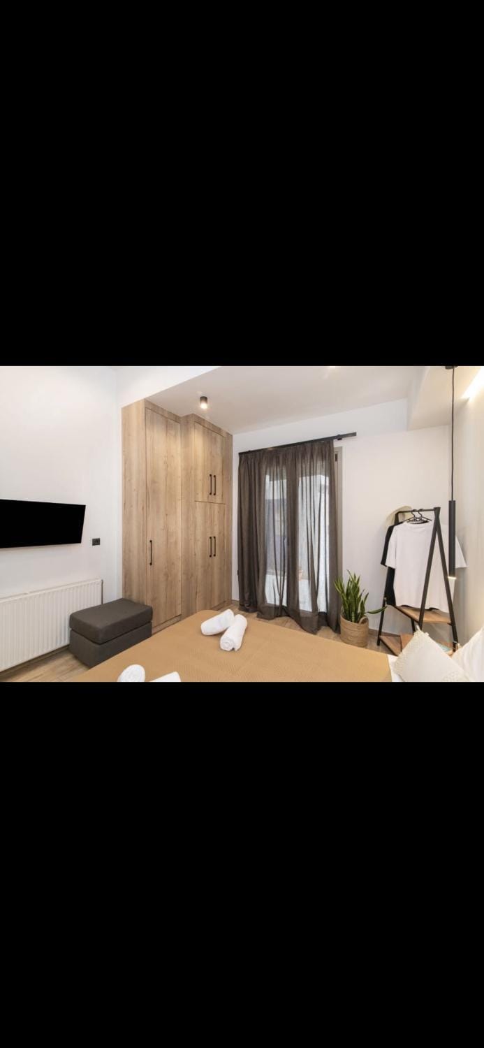 Bed, towels, wardrobe