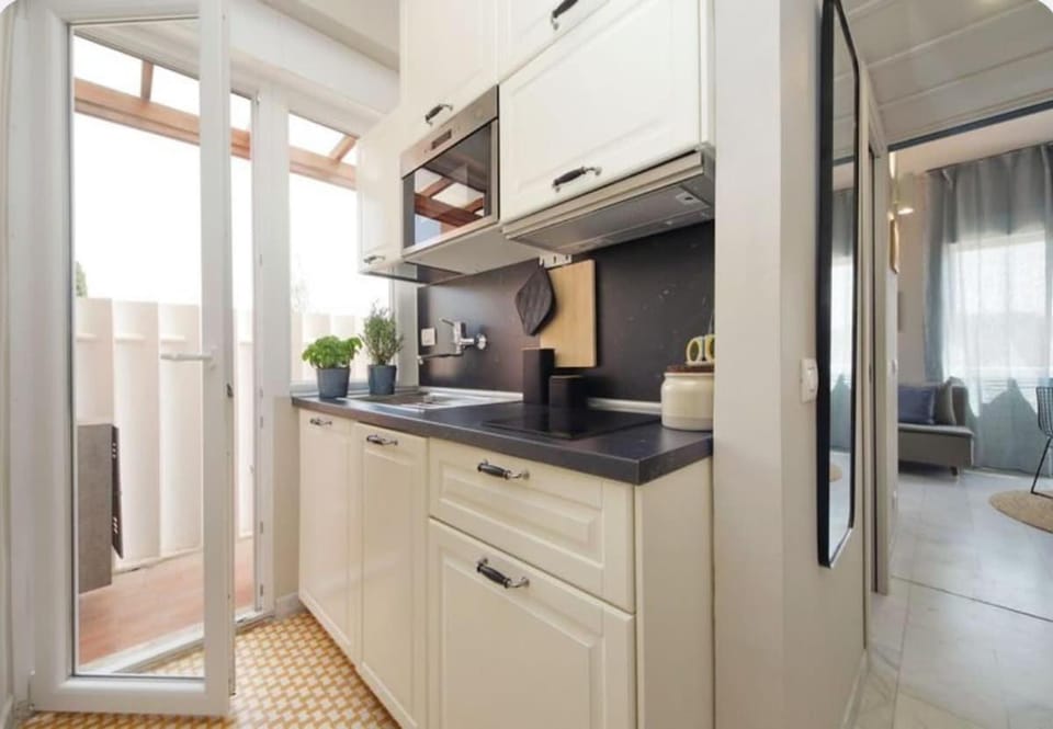 Kitchen or kitchenette, dishwasher, oven, stove