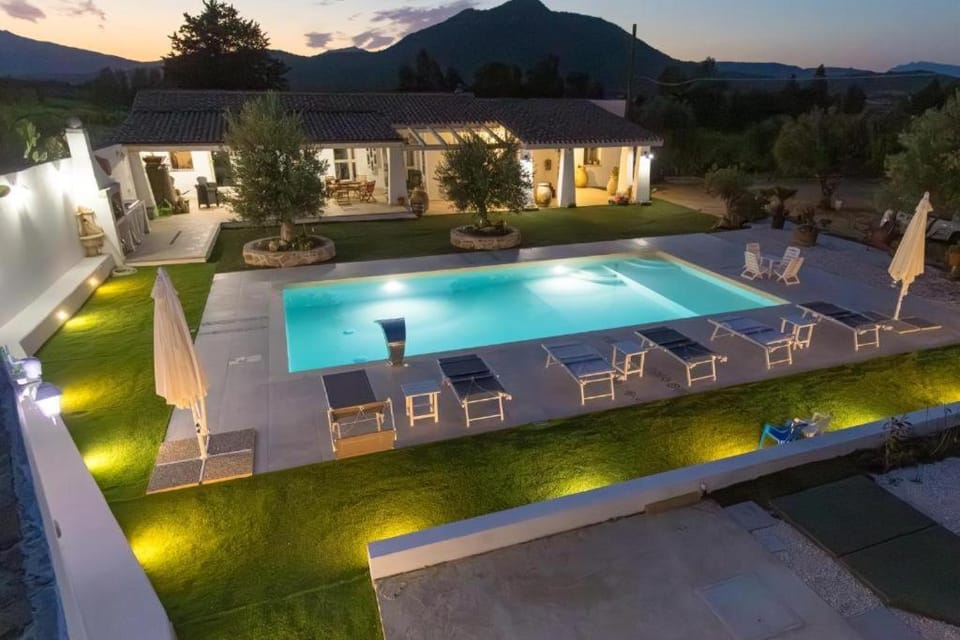 Property building, Patio, Night, Natural landscape, Pool view, Swimming pool, sunbed