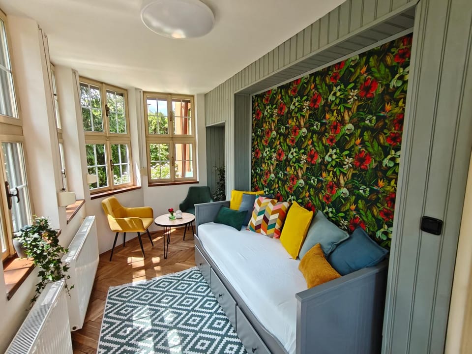 Bed, View (from property/room), Living room, Seating area, Bedroom, Garden view