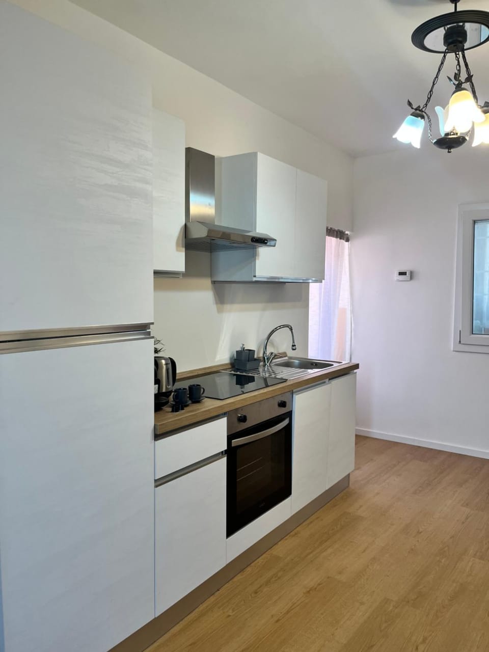 Kitchen or kitchenette, dishwasher, oven, stove