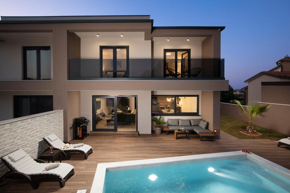 Property building, Patio, Night, Natural landscape, View (from property/room), Balcony/Terrace, Seating area, Pool view, Swimming pool, sunbed