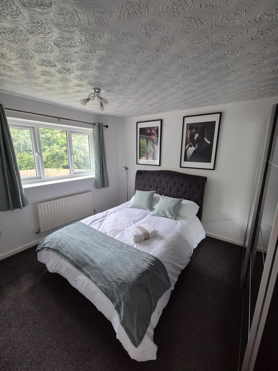 Bed, towels, wardrobe