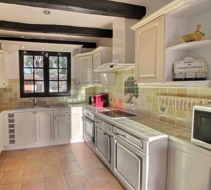 Kitchen or kitchenette, dishwasher, oven, stove, toaster, washing machine