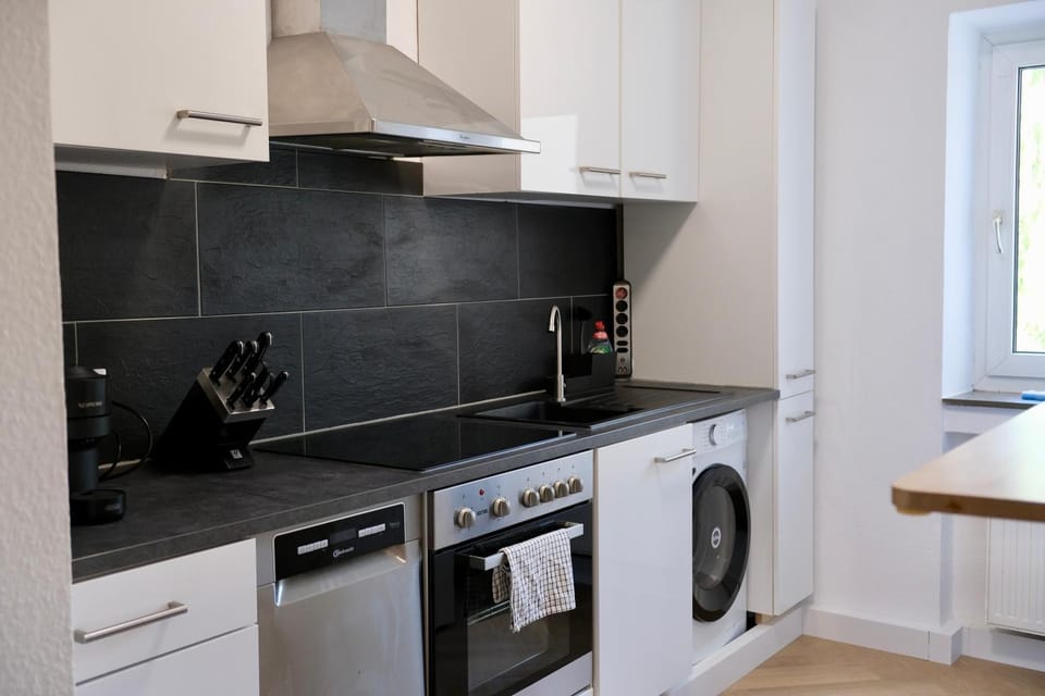 Kitchen or kitchenette, dishwasher, oven, stove, toaster, washing machine, dryer