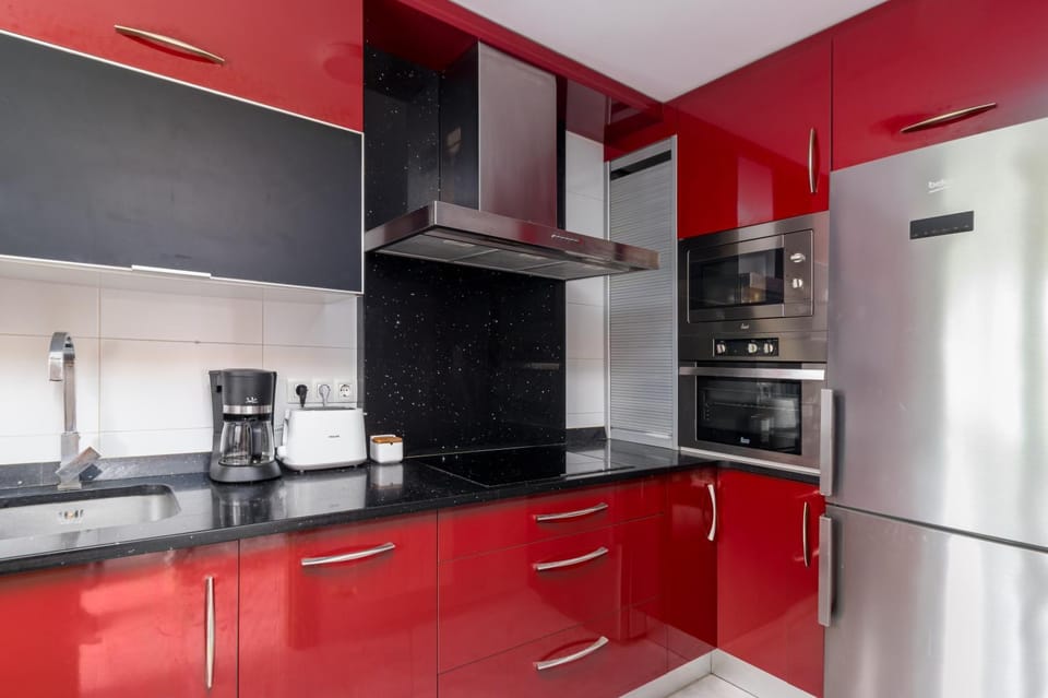 Kitchen or kitchenette, dishwasher, oven, stove, toaster