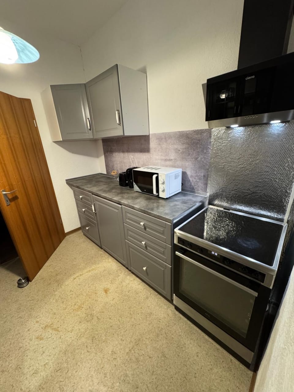 Kitchen or kitchenette, dishwasher, oven, stove