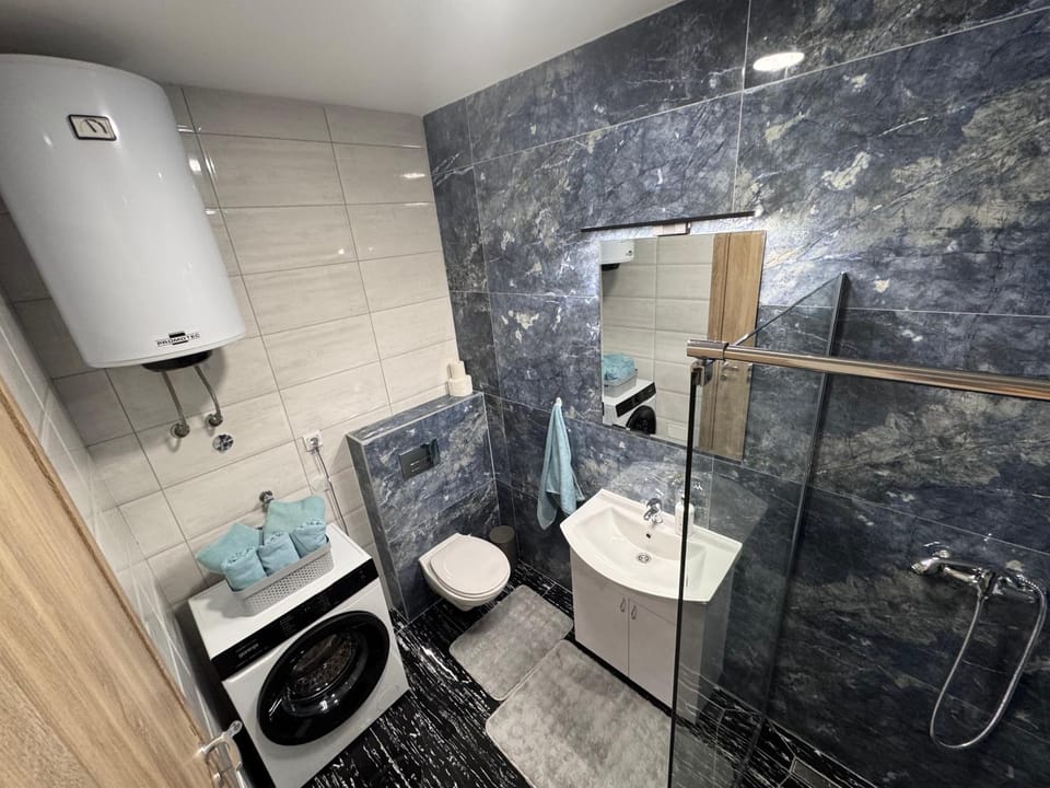 Shower, Toilet, Bathroom, towels, washing machine, dryer