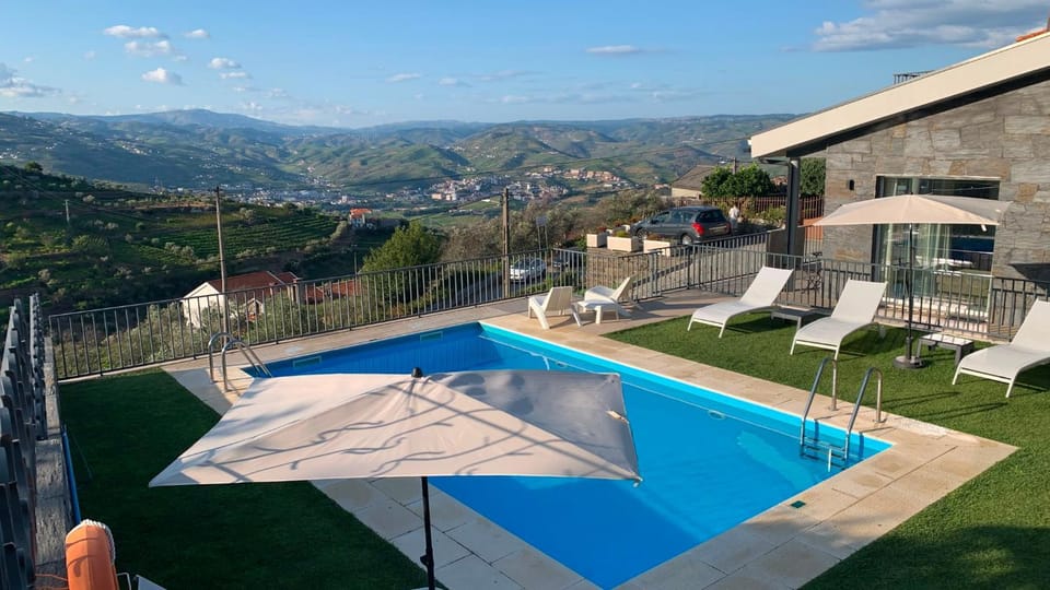 Property building, Natural landscape, Landmark view, Swimming pool, sunbed