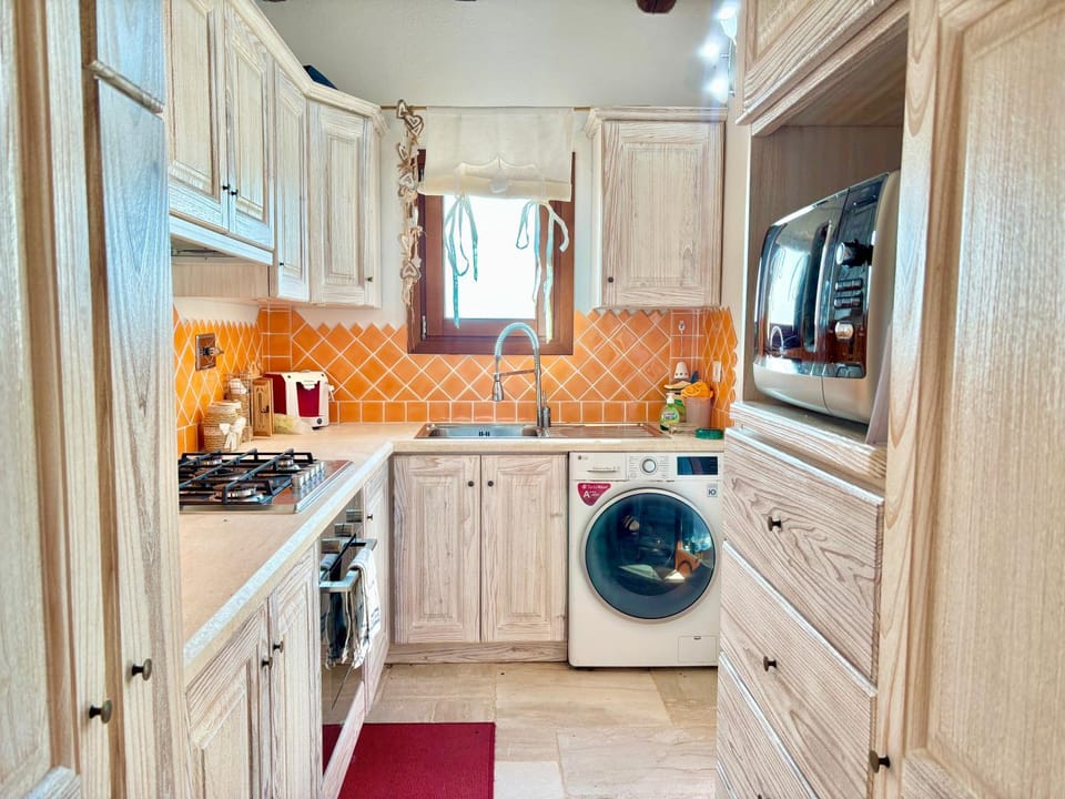 Kitchen or kitchenette, oven, stove, washing machine