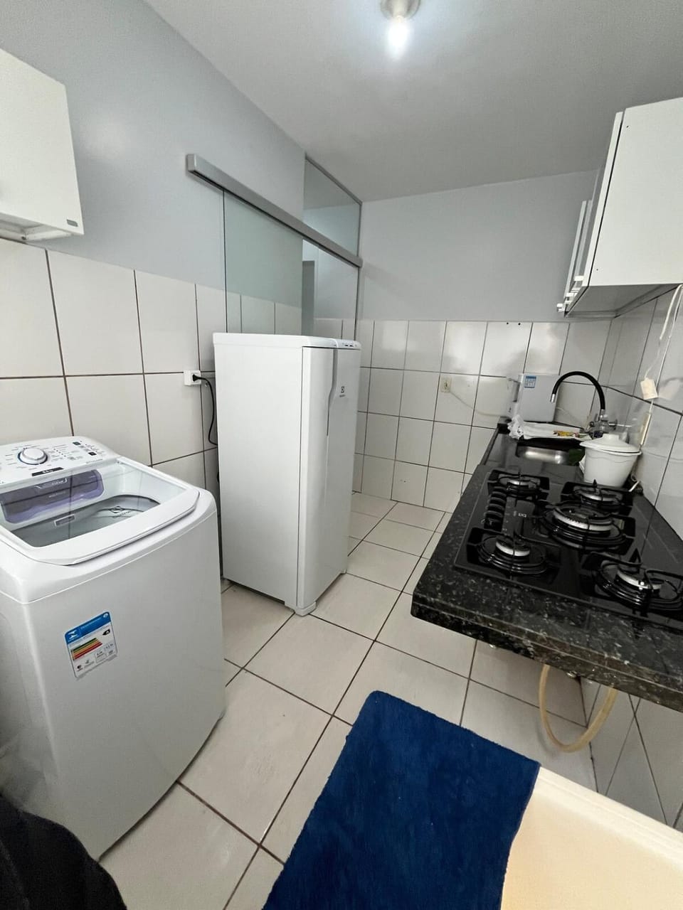 Kitchen or kitchenette, stove, toaster, washing machine