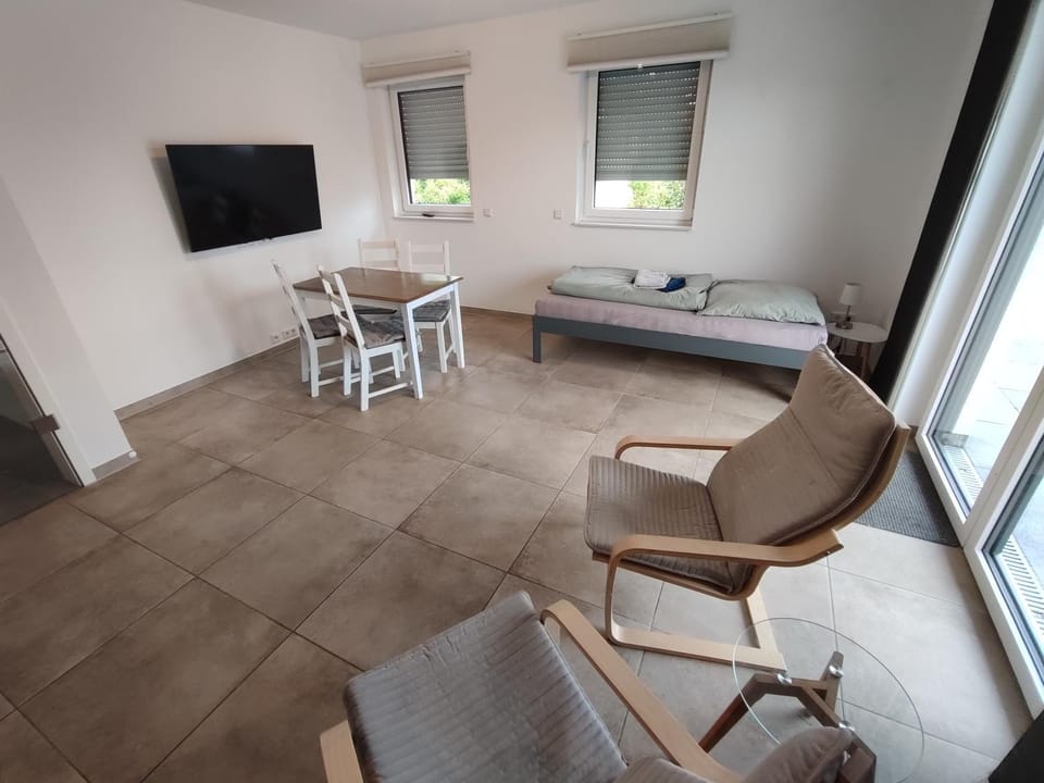 Bed, TV and multimedia, Living room, Photo of the whole room, Seating area