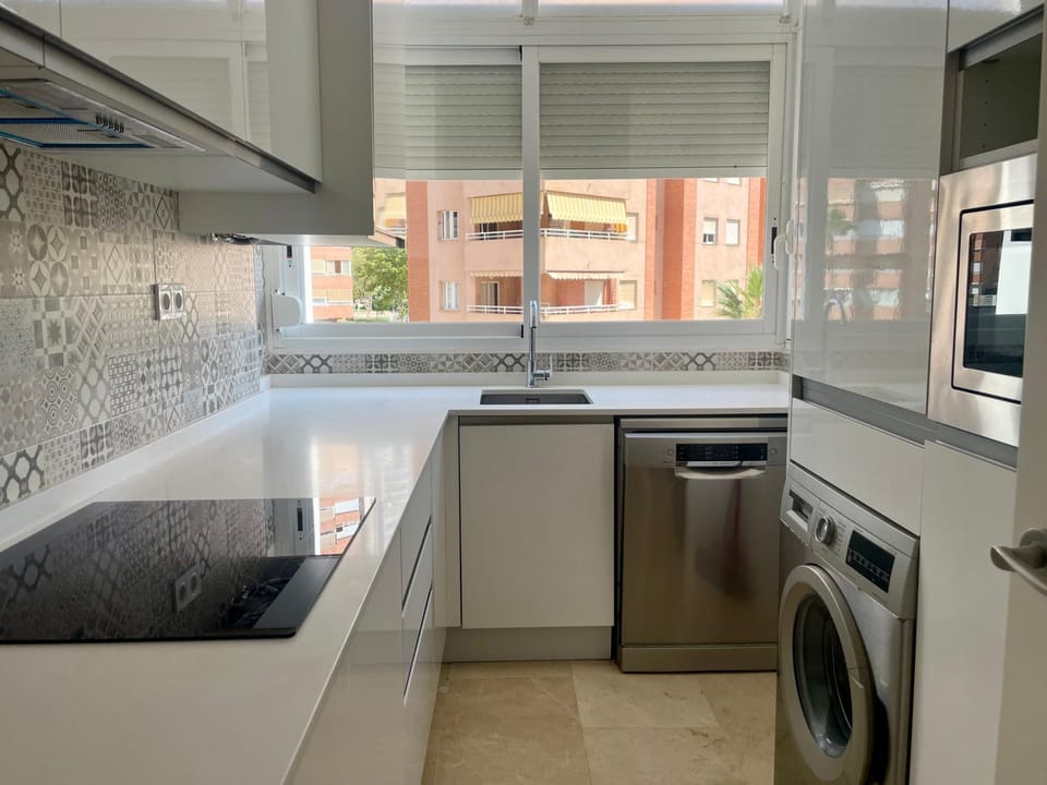 Kitchen or kitchenette, dishwasher, stove, washing machine