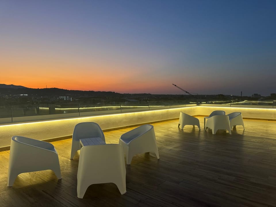 View (from property/room), Balcony/Terrace, Seating area, Mountain view, Sunset