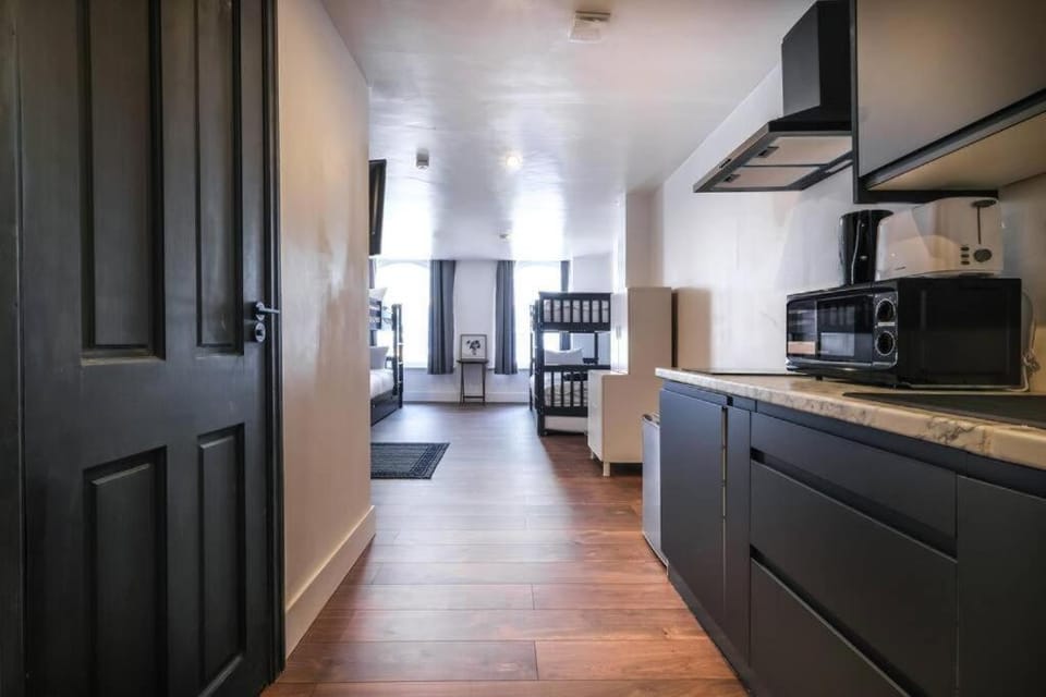 Kitchen or kitchenette, stove, toaster