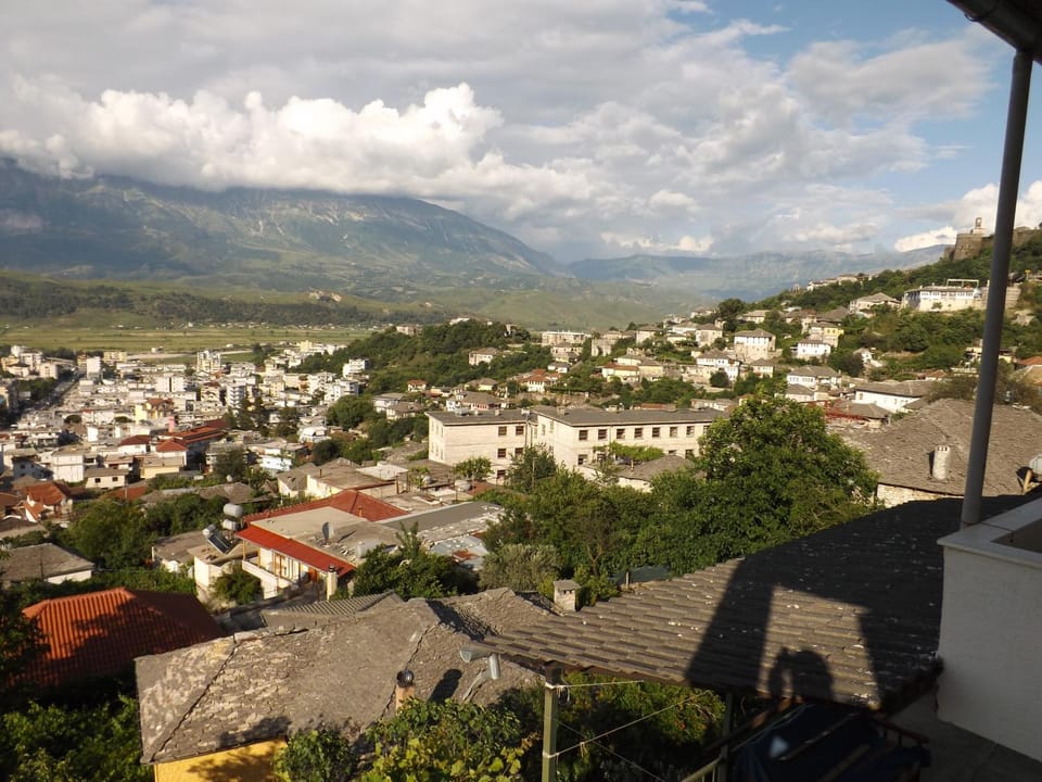 Property building, Nearby landmark, Day, Neighbourhood, Natural landscape, City view, Mountain view, Street view