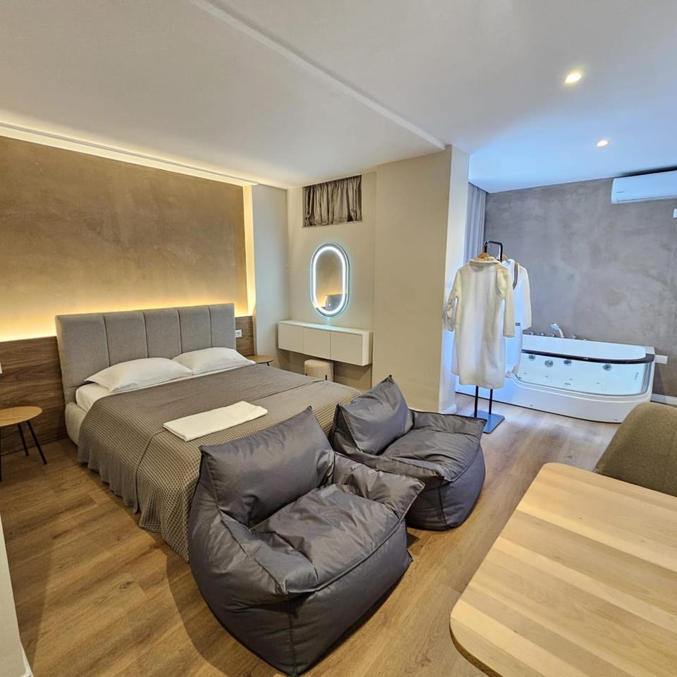 Bed, Hot Tub, Seating area