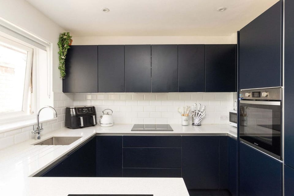 Kitchen or kitchenette, dishwasher, oven, stove, toaster