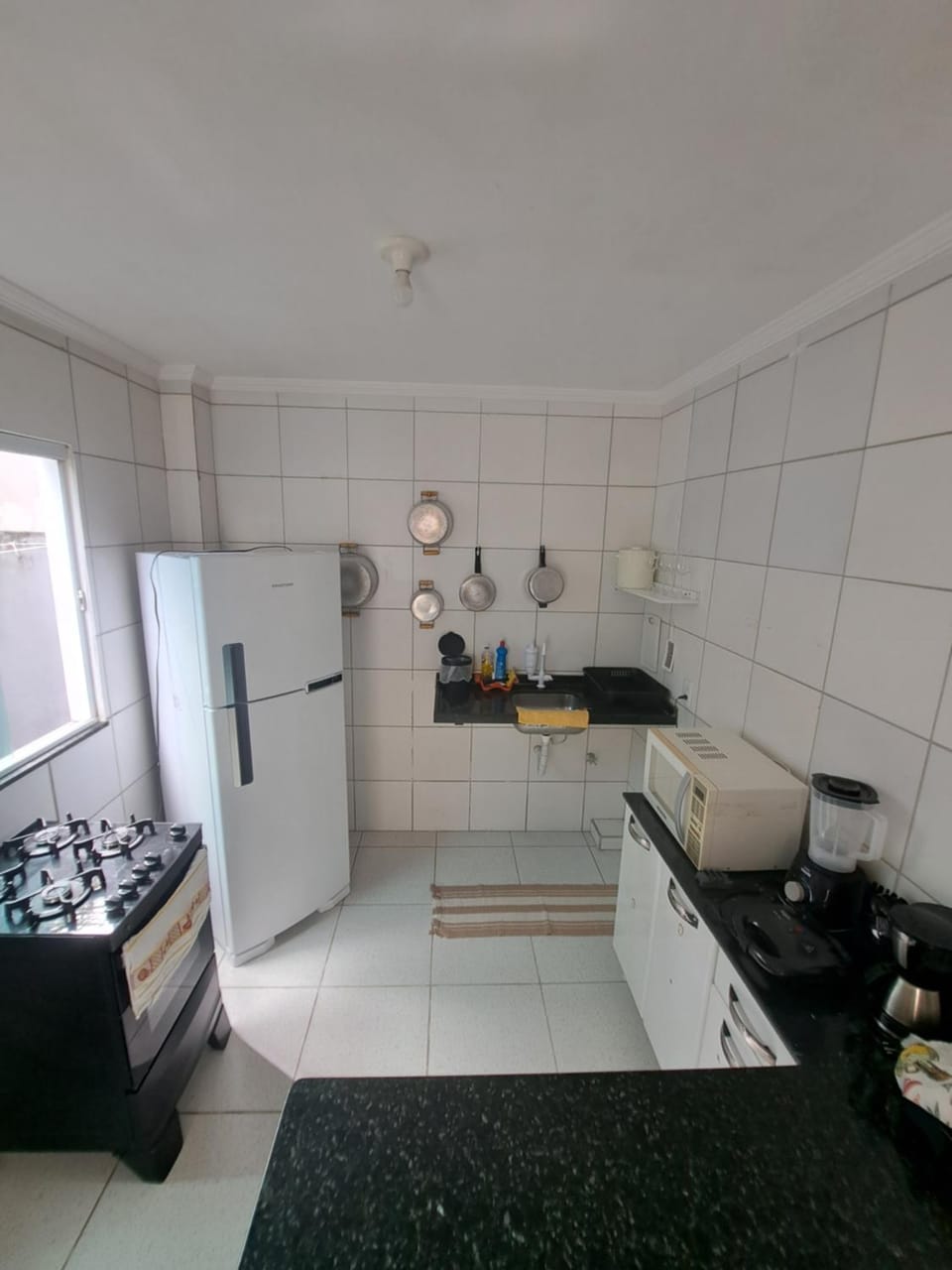 Kitchen or kitchenette, locker, microwave, oven, stove, toaster