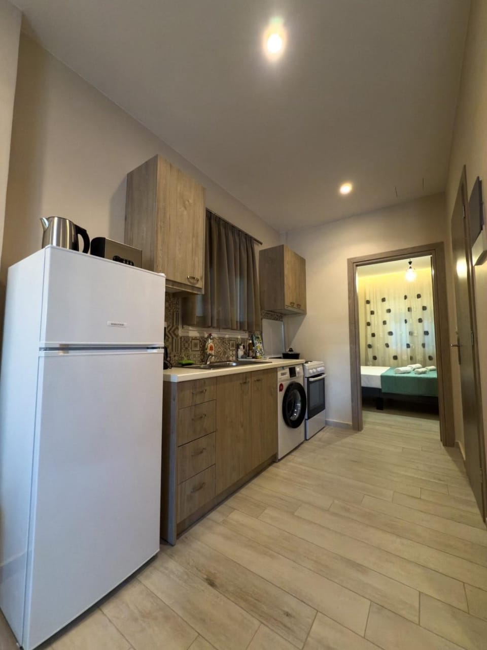 Kitchen or kitchenette, oven, stove, washing machine