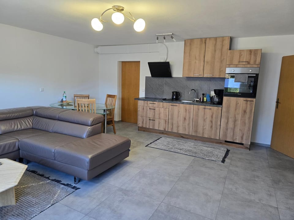 Kitchen or kitchenette, Living room, Seating area, Dining area