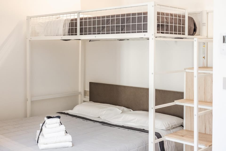 Bed, Photo of the whole room, Bedroom, bunk bed, towels, air conditioner