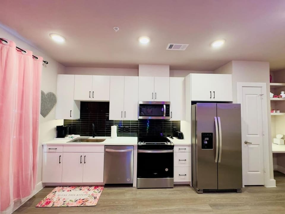 Kitchen or kitchenette, dishwasher, oven, stove