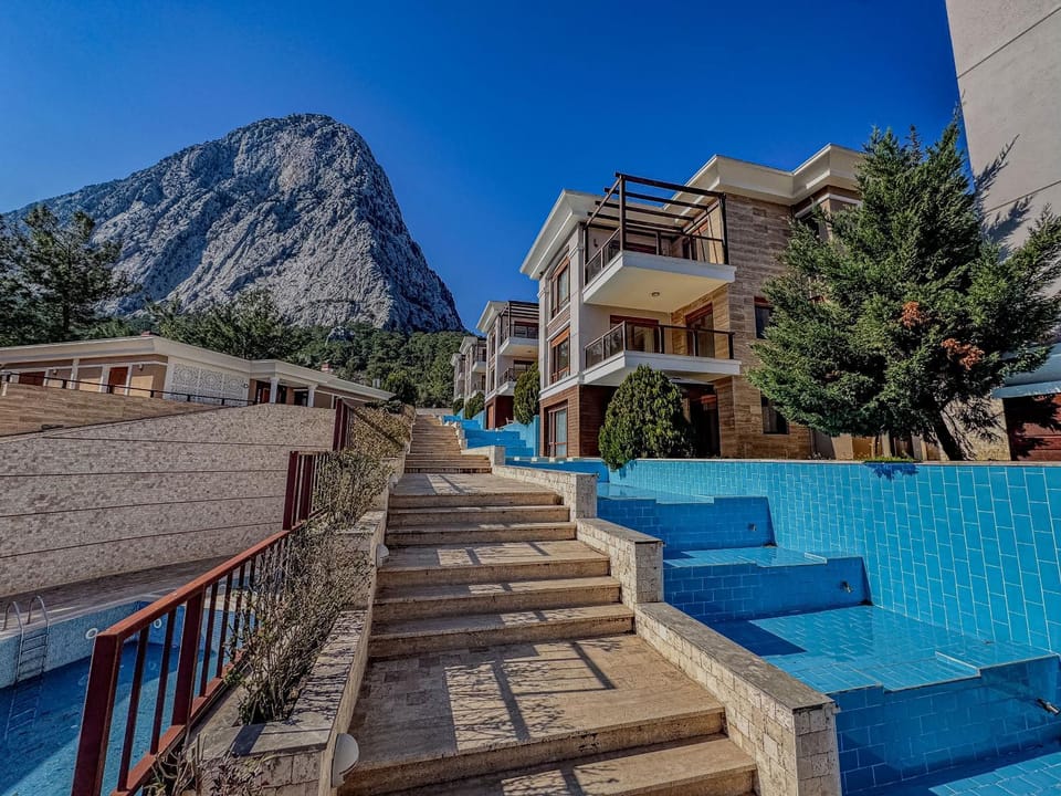Property building, Nearby landmark, Natural landscape, Mountain view