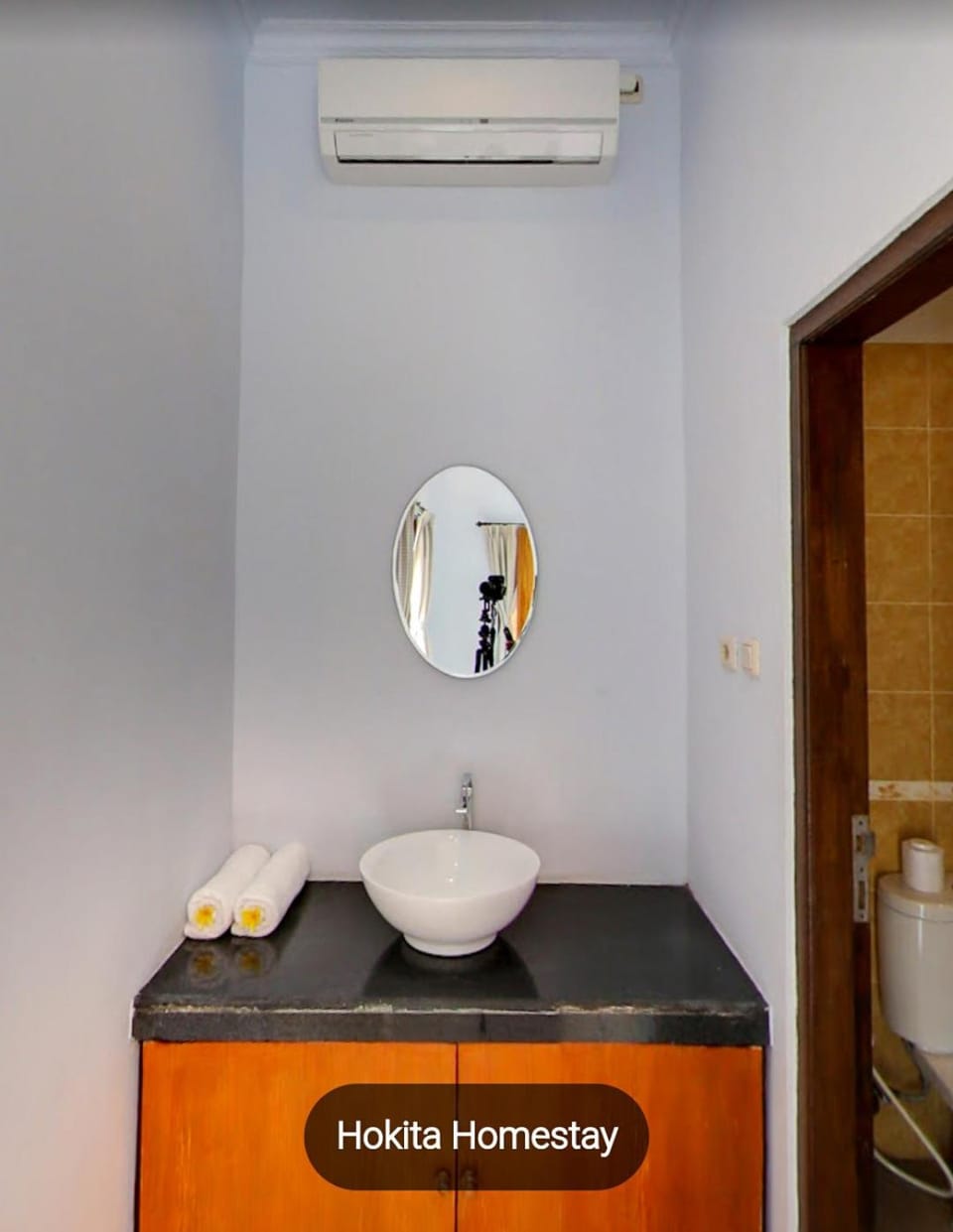 Text overlay, towels, air conditioner