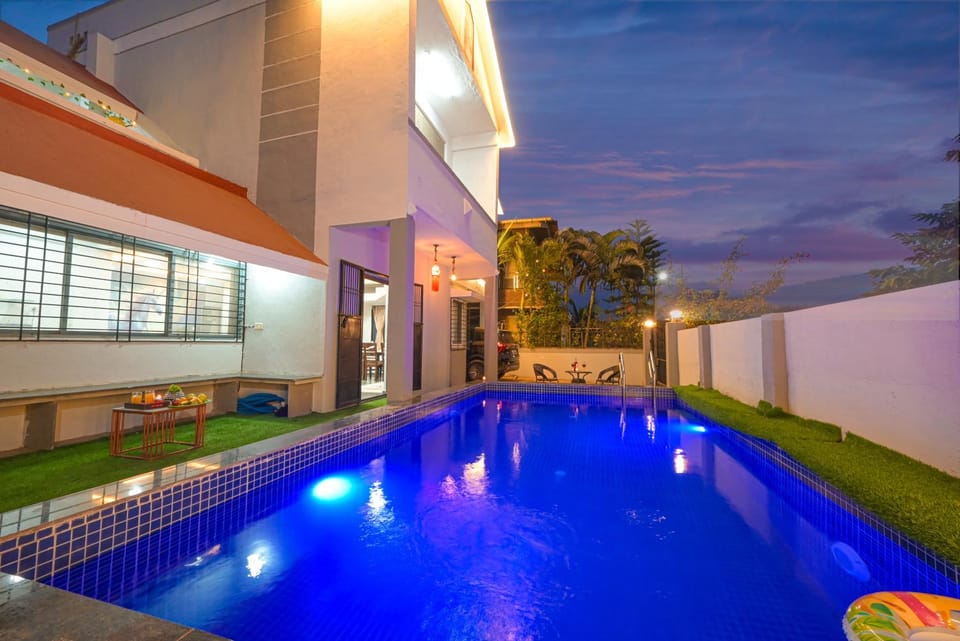 Property building, Patio, Night, Pool view, Swimming pool, sunbed