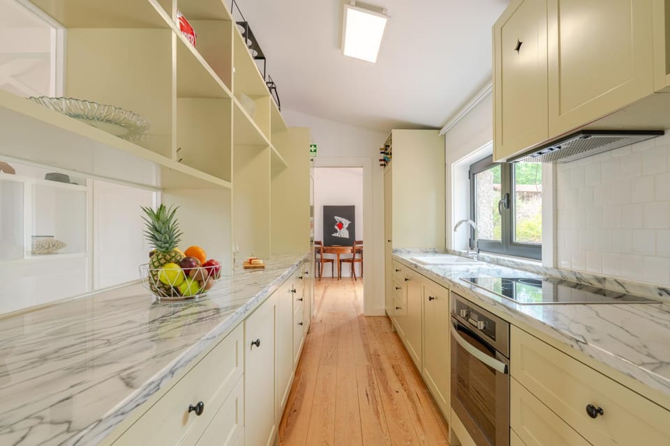 Kitchen or kitchenette, dishwasher, oven, stove