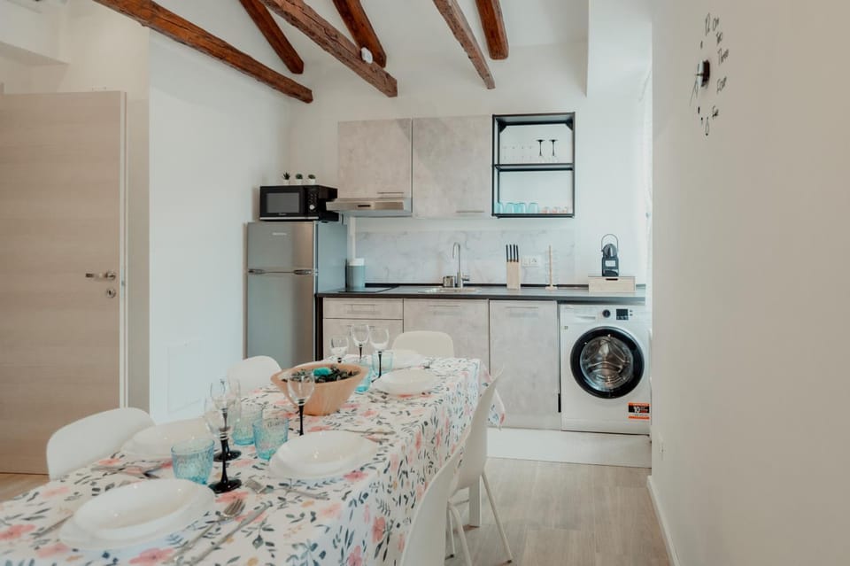 Kitchen or kitchenette, stove, washing machine