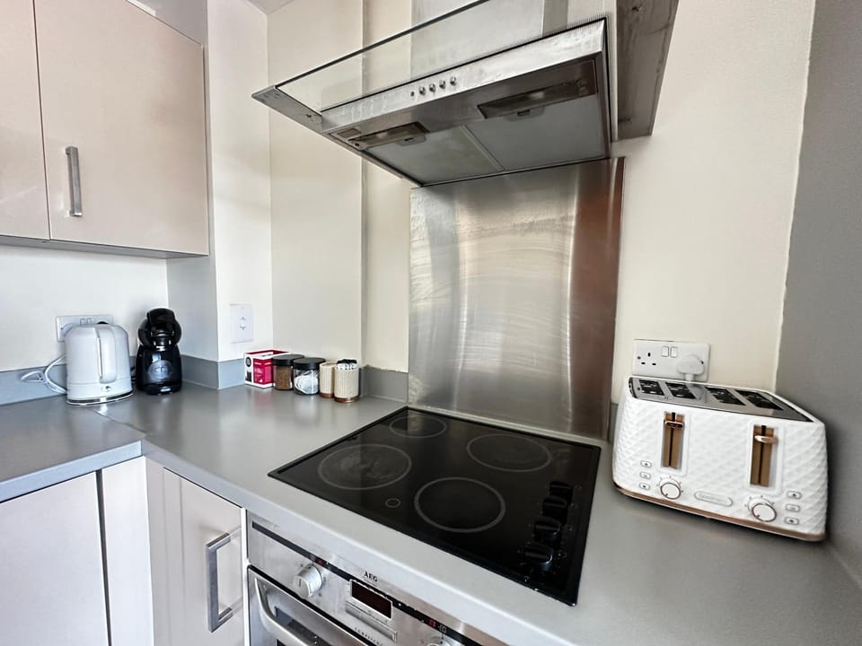 Kitchen or kitchenette, oven, stove, toaster