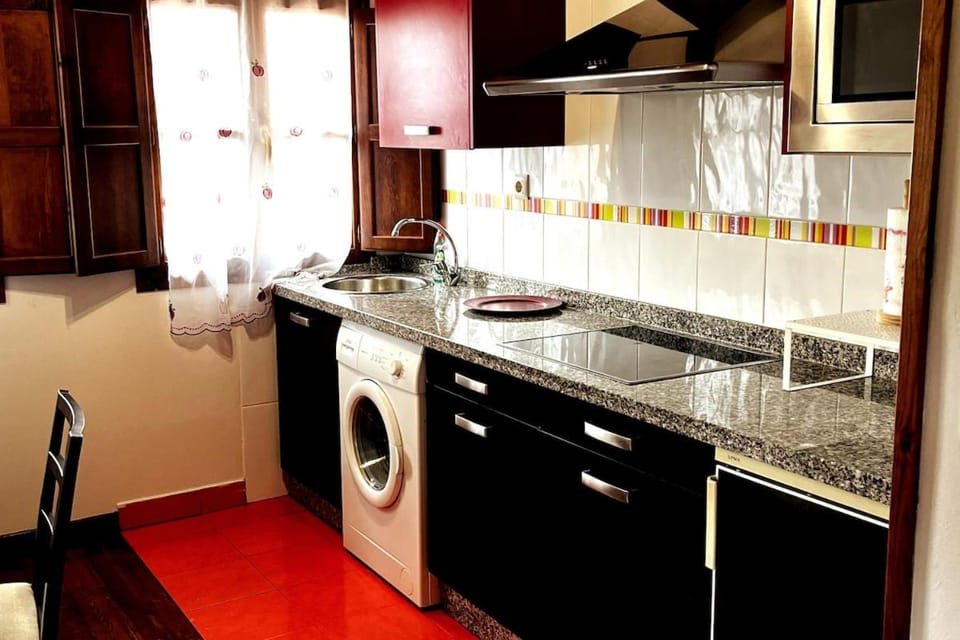 Kitchen or kitchenette, stove, washing machine
