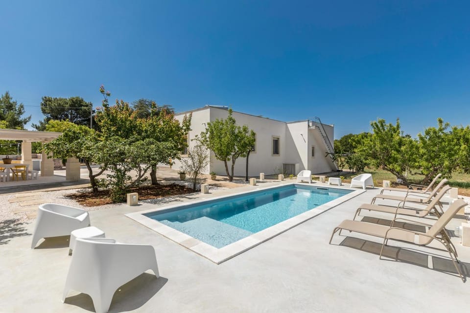 Property building, Patio, Swimming pool, sunbed