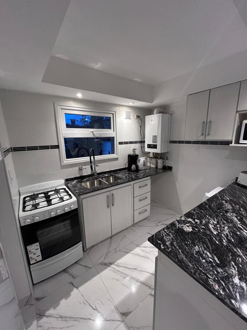 Kitchen or kitchenette, oven