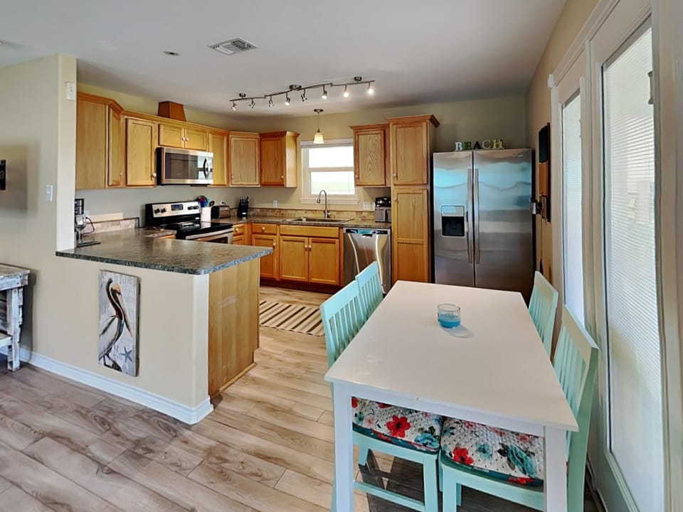 Kitchen or kitchenette, Seating area, Dining area, furniture, microwave, oven, stove