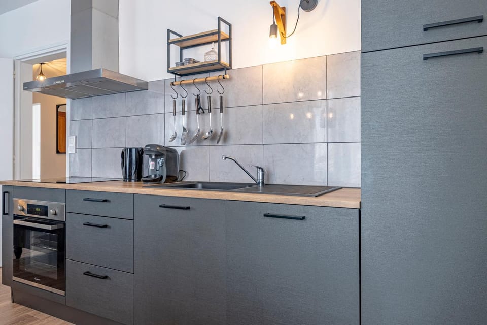 Kitchen or kitchenette, dishwasher, oven, stove, toaster