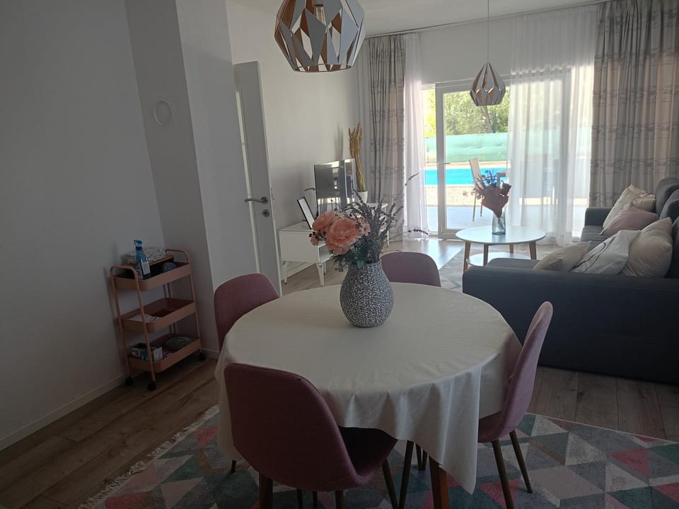 Living room, Seating area, Dining area, Pool view