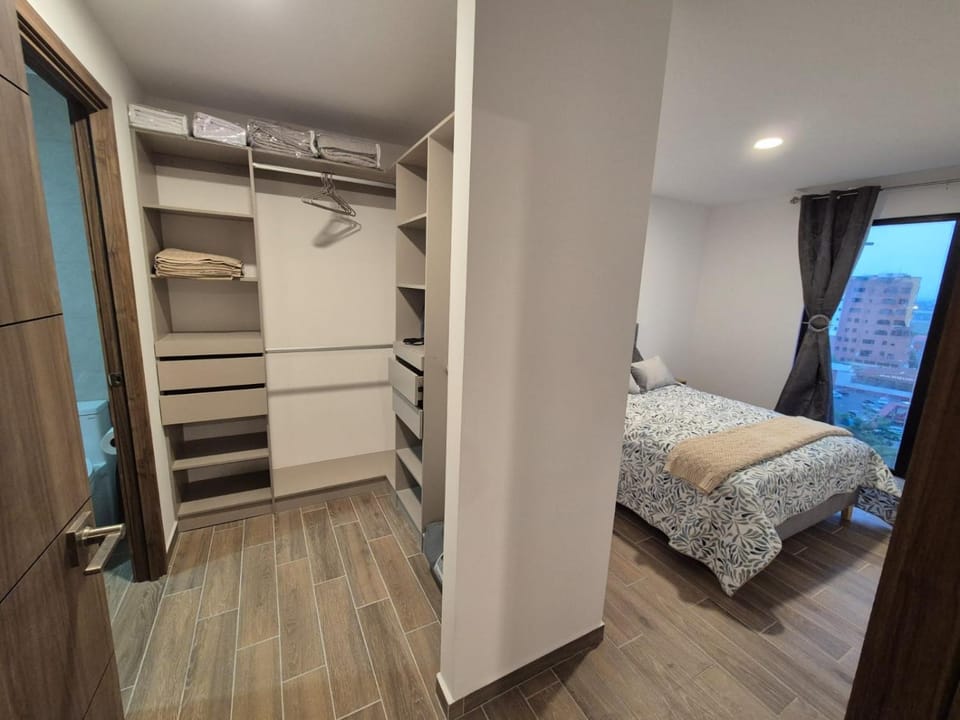 Bed, Photo of the whole room, Bedroom, flat iron, towels, wardrobe