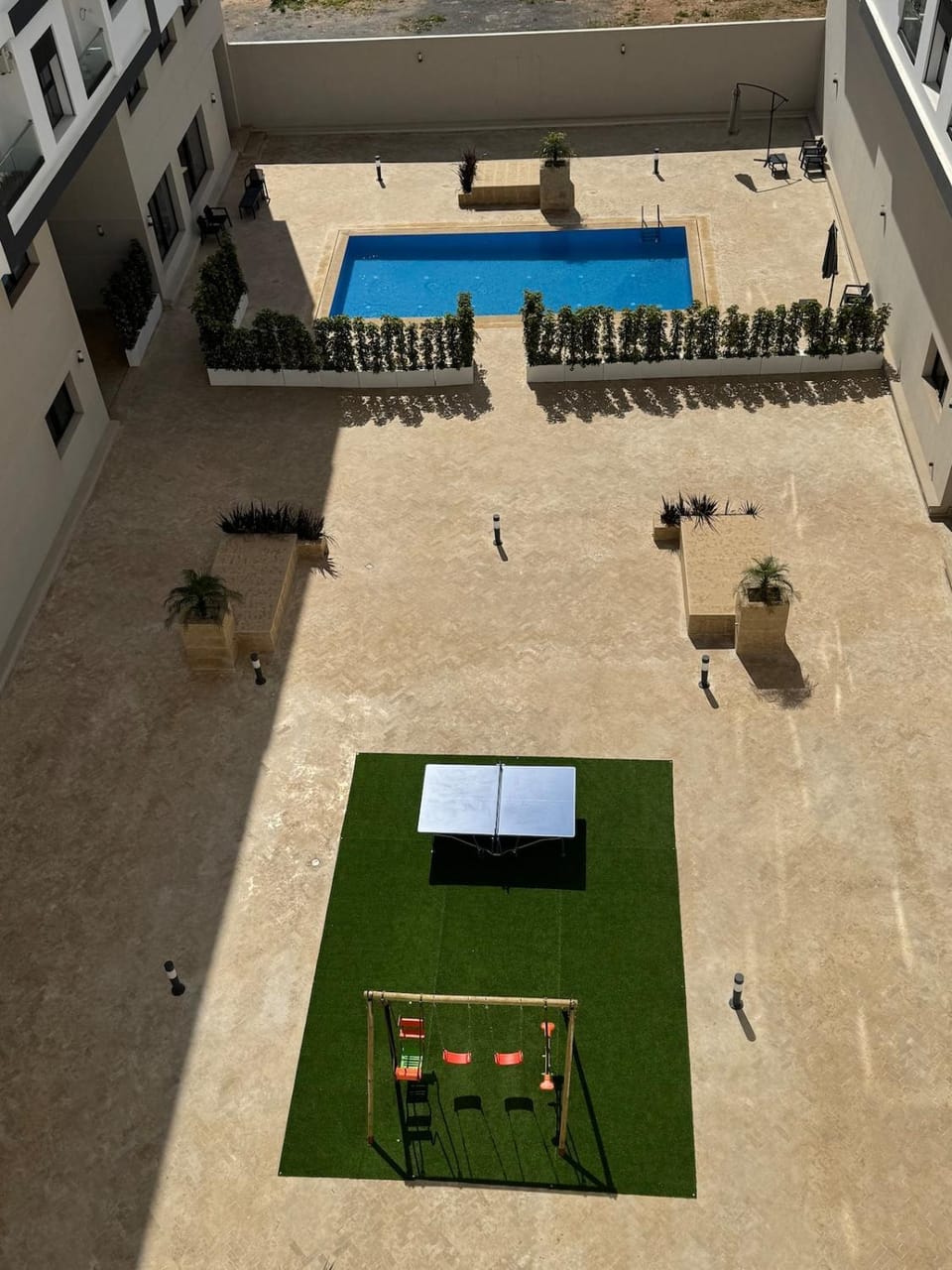 Property building, Day, Pool view, Swimming pool, sunbed