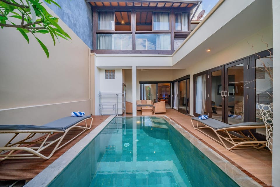 Property building, Patio, Pool view, Swimming pool, sunbed