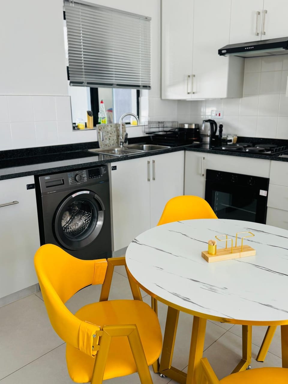 Kitchen or kitchenette, Dining area, oven, stove, toaster, washing machine