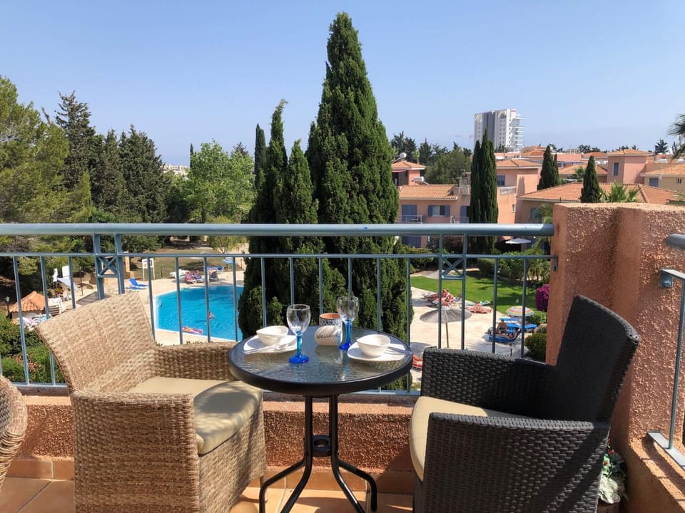 View (from property/room), Balcony/Terrace, Seating area, Dining area, Pool view, Swimming pool