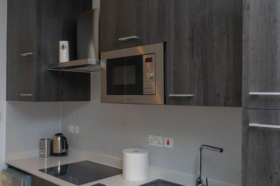 Kitchen or kitchenette, stove, toaster