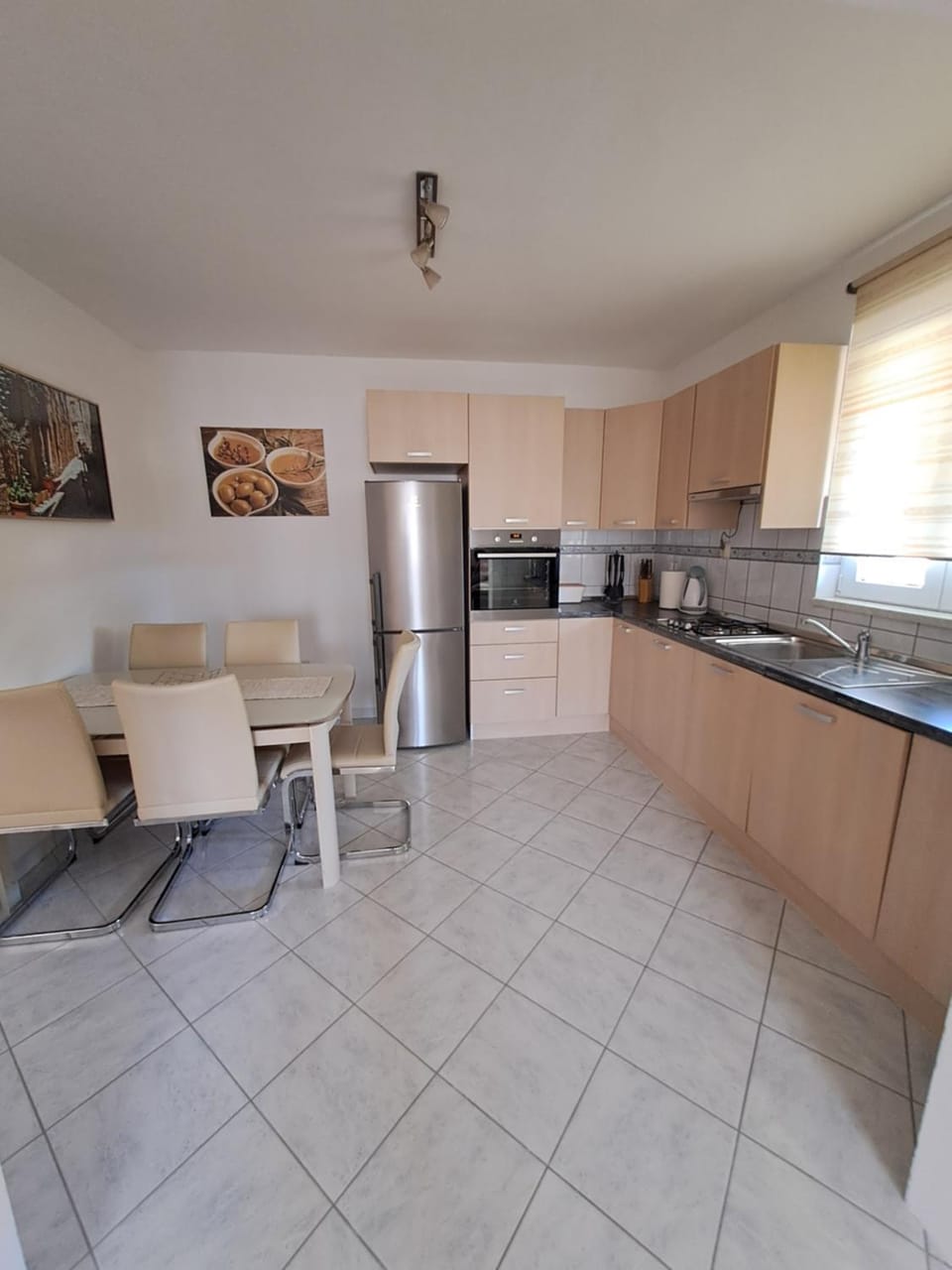 Kitchen or kitchenette, dishwasher, oven, stove