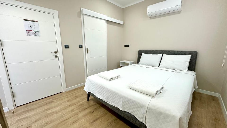 Bed, Bedroom, towels, wardrobe, air conditioner