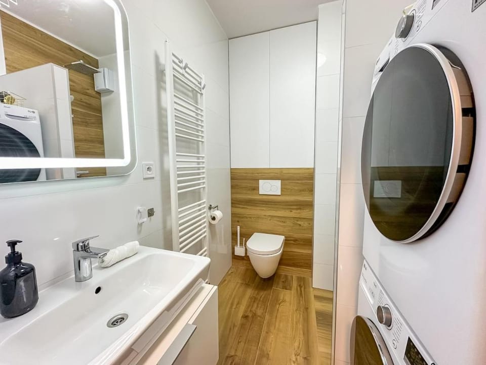 Shower, Toilet, Bathroom, towels, washing machine, dryer